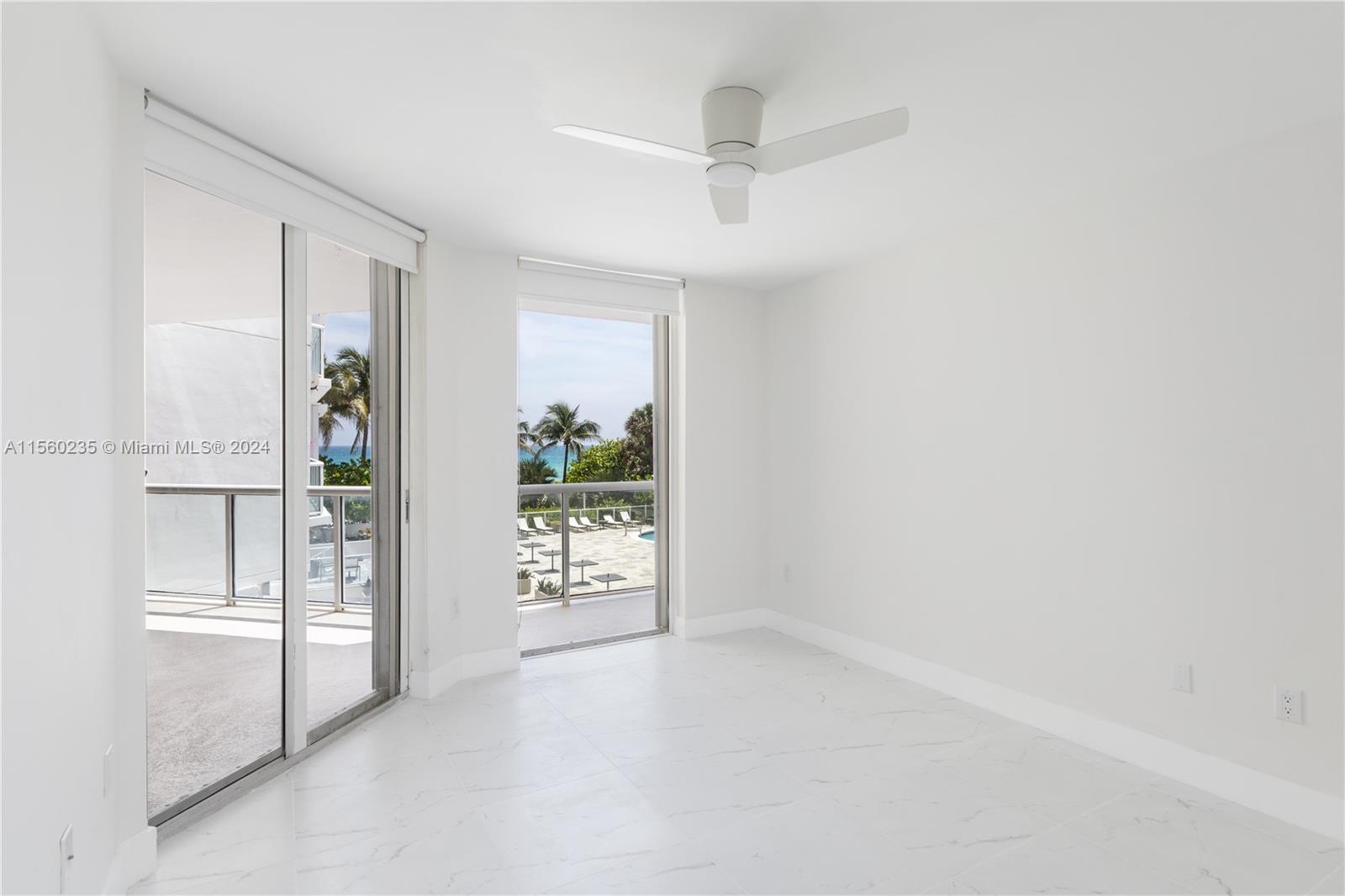 8925 Collins Avenue, Unit 2J Surfside, FL 33154 - Photo 46 of 62 an empty room with windows