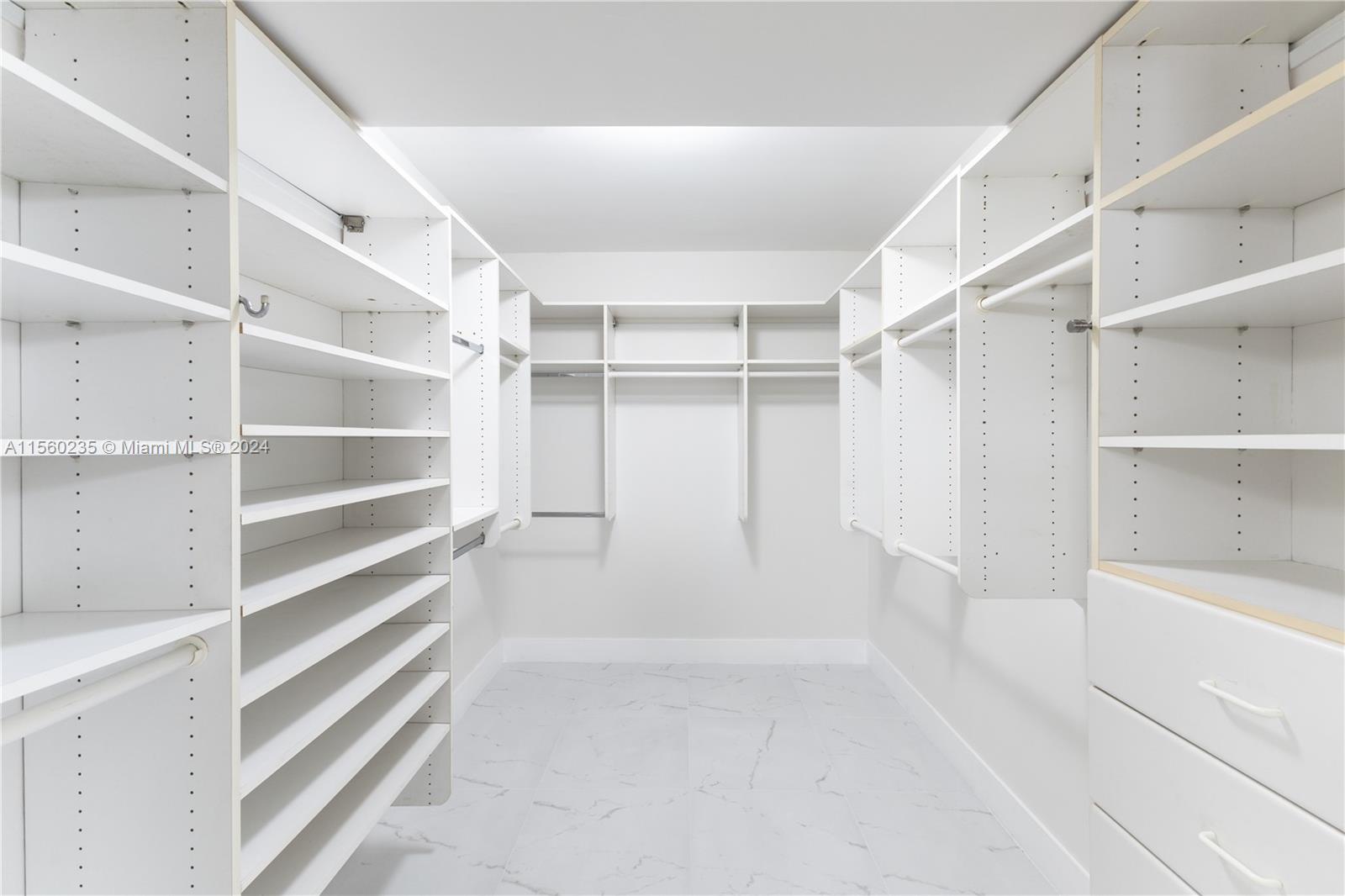 8925 Collins Avenue, Unit 2J Surfside, FL 33154 - Photo 47 of 62 a view of an empty walk in closet