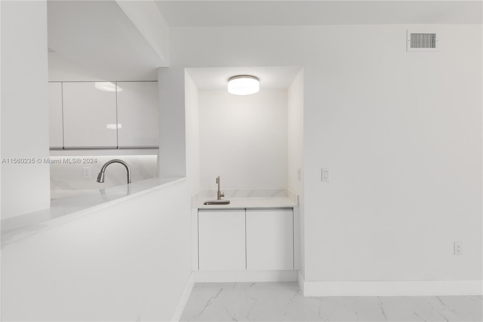 8925 Collins Avenue, Unit 2J Surfside, FL 33154 - Photo 55 of 62 a bathroom with a sink and a bathtub