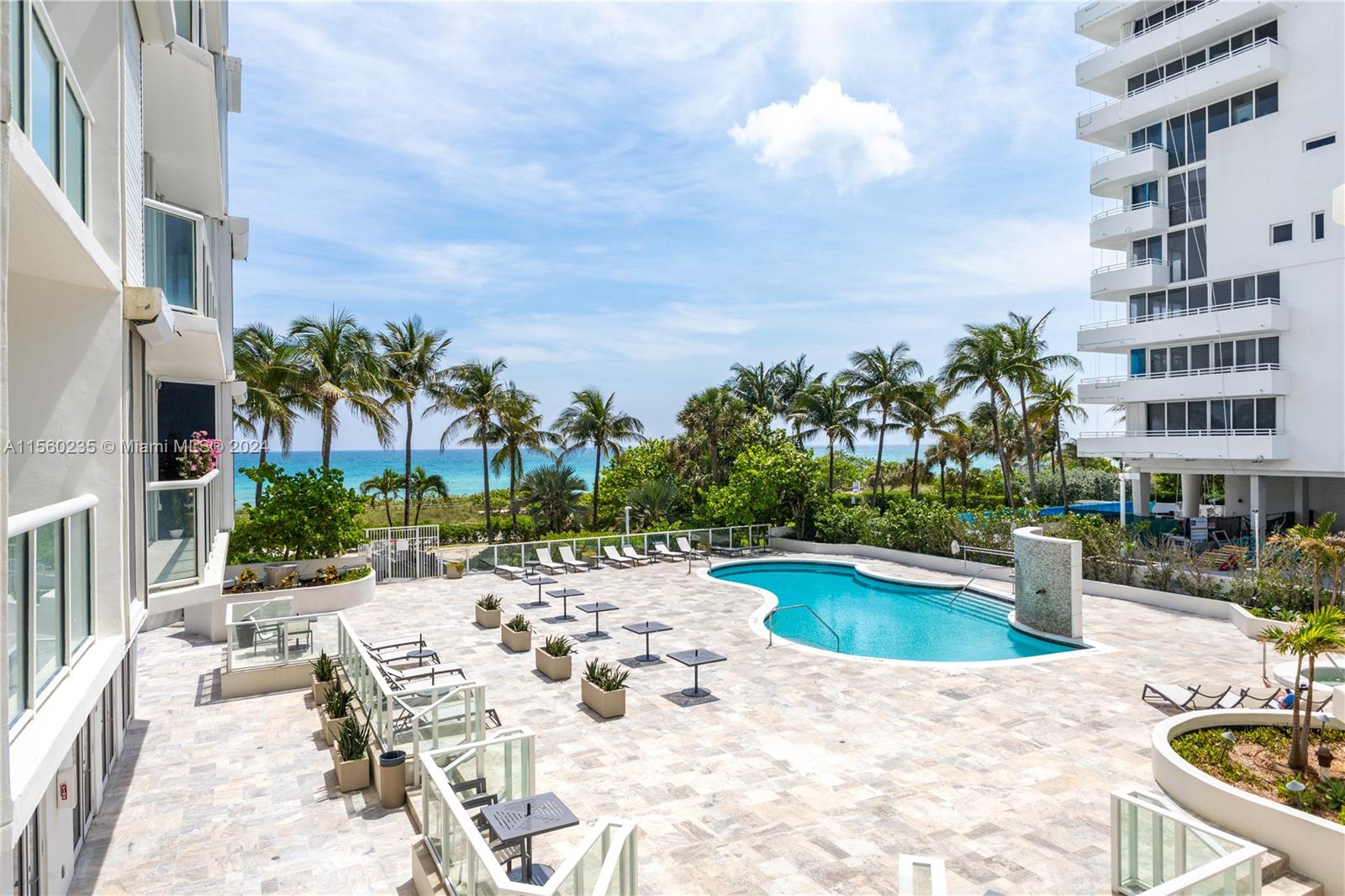 8925 Collins Avenue, Unit 2J Surfside, FL 33154 - Photo 60 of 62 a view of a swimming pool with a patio