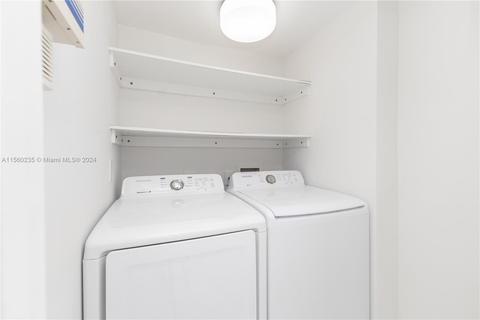 8925 Collins Avenue, Unit 2J Surfside, FL 33154 - Photo 61 of 62 a utility room with dryer and washer