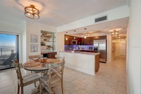 a kitchen with a table and chairs in it
