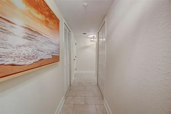 a view of hallway with wooden floor