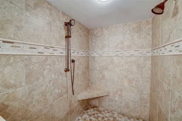 a view of a chair and table in the balcony