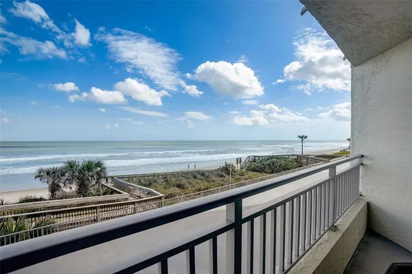 a view of a balcony with an outdoor space