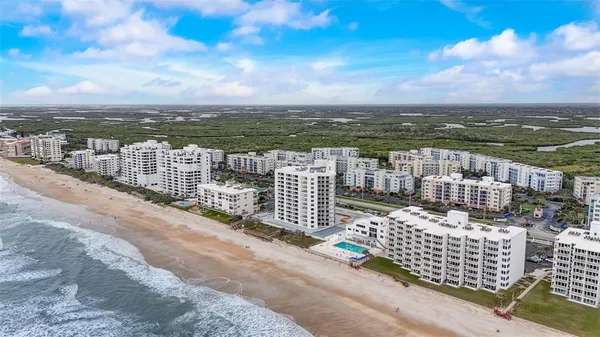 a view of city with ocean