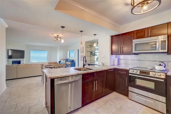 a kitchen with a sink stove and microwave