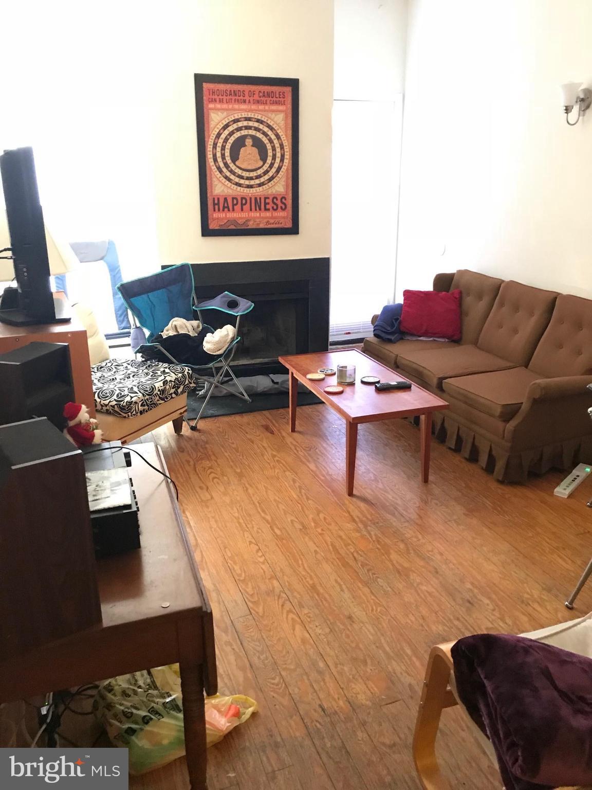 321 Scott Street Baltimore, MD 21230 - Photo 9 of 21 Living Room with Hardwood and Leading to Deck