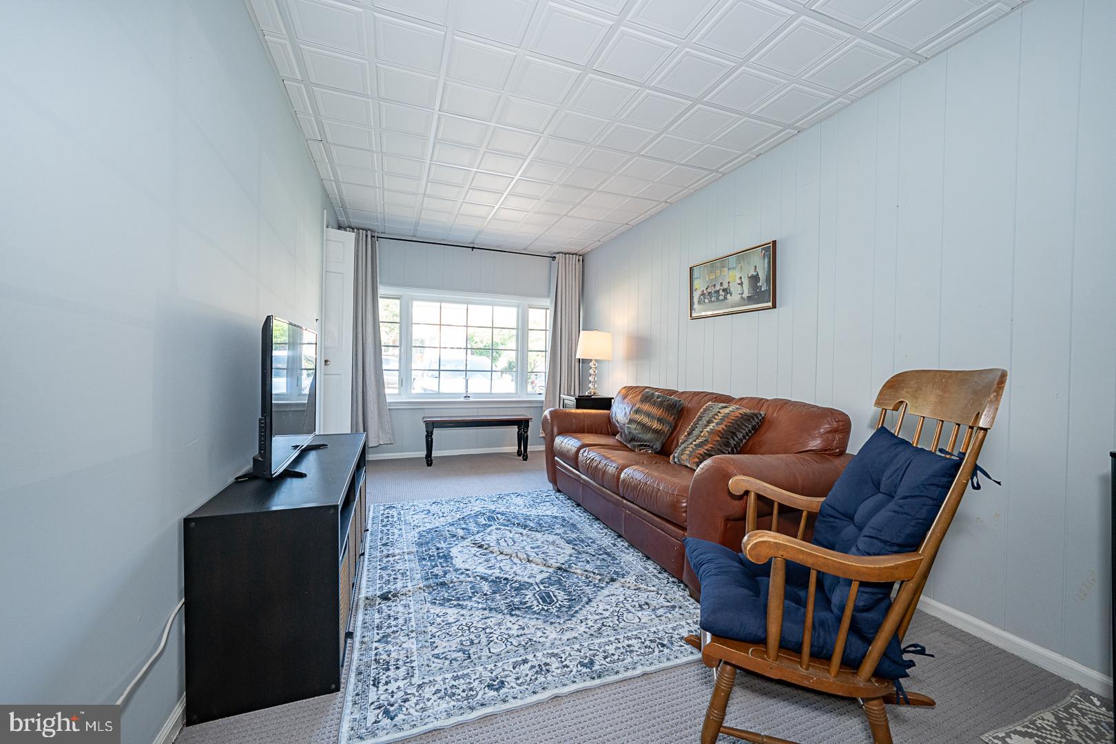 33 Rittenhouse Road Broomall, PA 19008 - Photo 11 of 47 a living room with furniture and a window