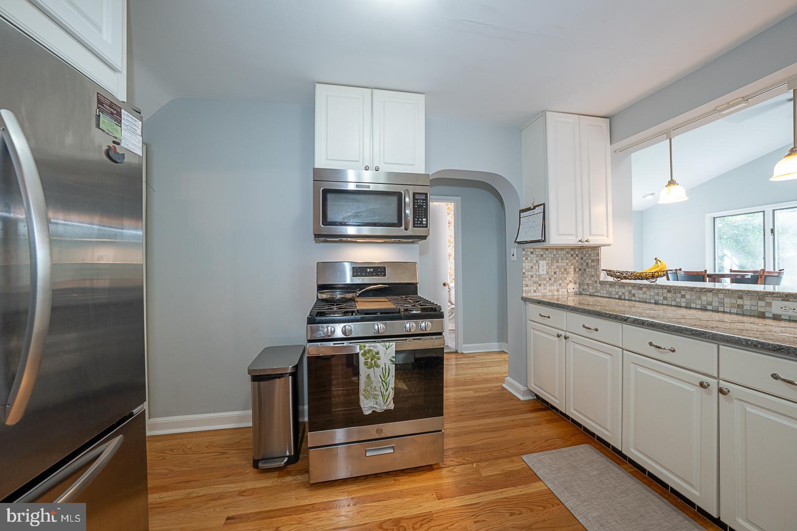 33 Rittenhouse Road Broomall, PA 19008 - Photo 15 of 47 a kitchen with stainless steel appliances granite countertop a stove and a refrigerator