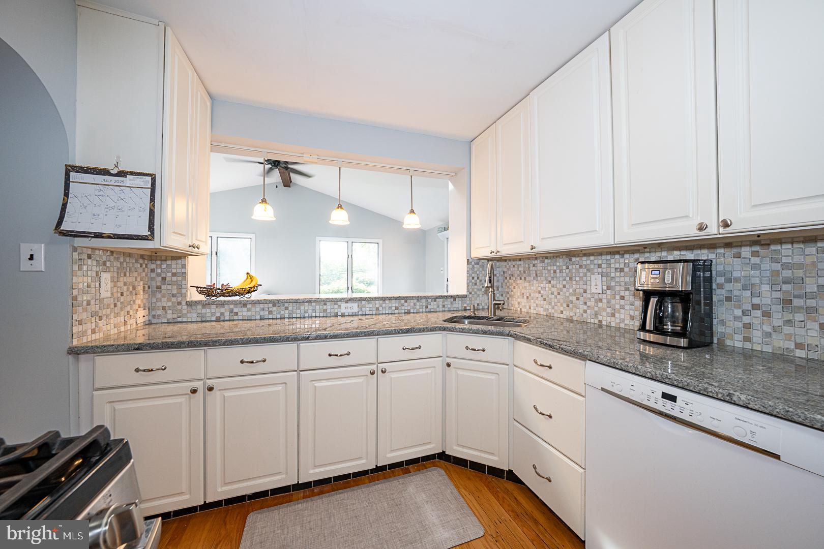 33 Rittenhouse Road Broomall, PA 19008 - Photo 16 of 47 a kitchen with granite countertop white cabinets and a sink
