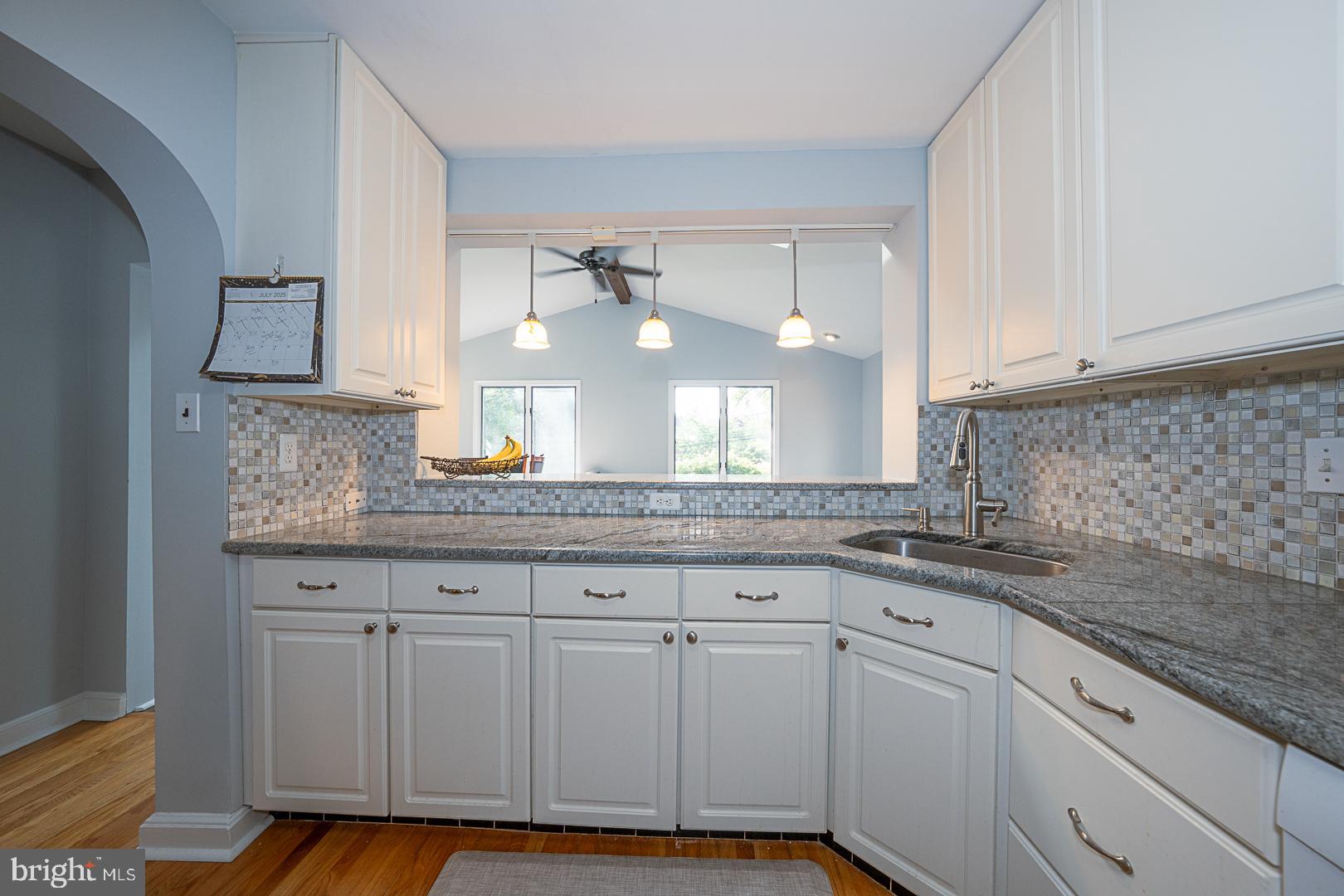 33 Rittenhouse Road Broomall, PA 19008 - Photo 17 of 47 a kitchen with granite countertop white cabinets and a sink