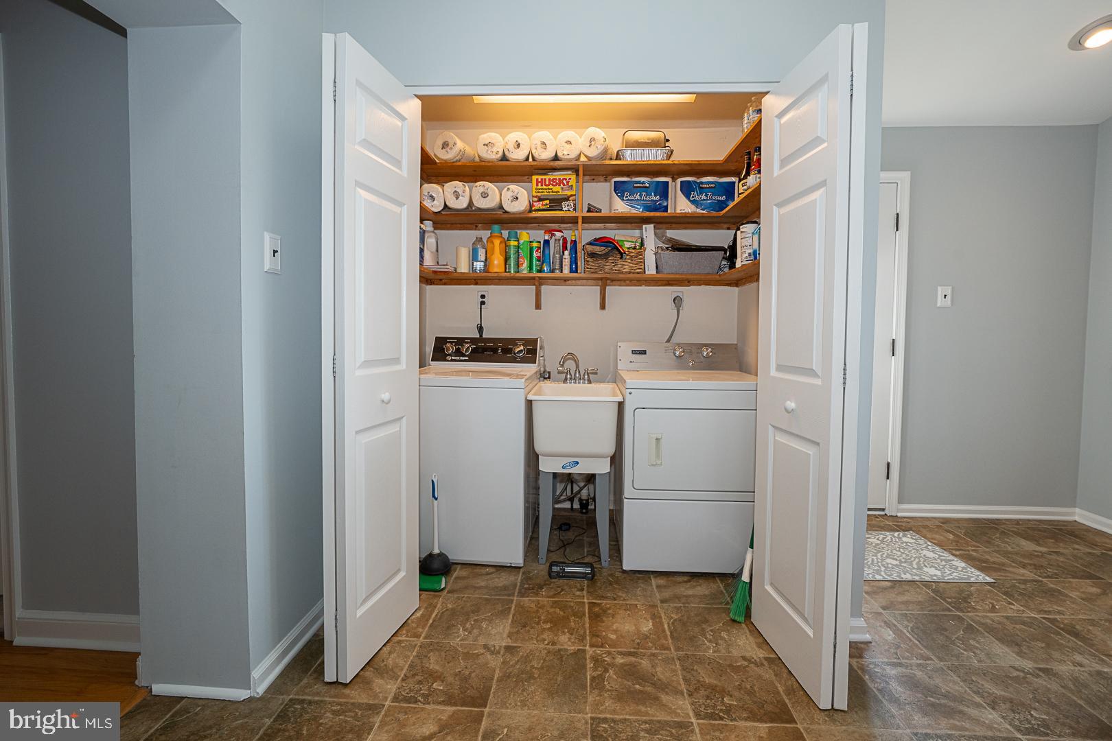 33 Rittenhouse Road Broomall, PA 19008 - Photo 25 of 47 a view of cabinets with washer and dryer