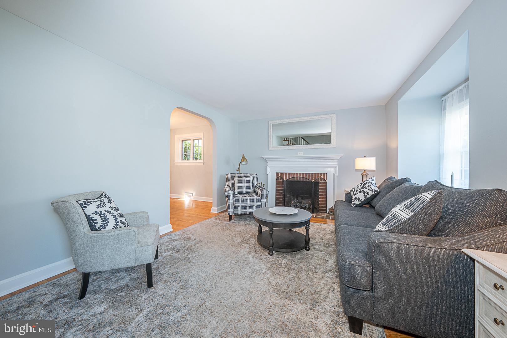 33 Rittenhouse Road Broomall, PA 19008 - Photo 4 of 47 a living room with furniture and a fireplace