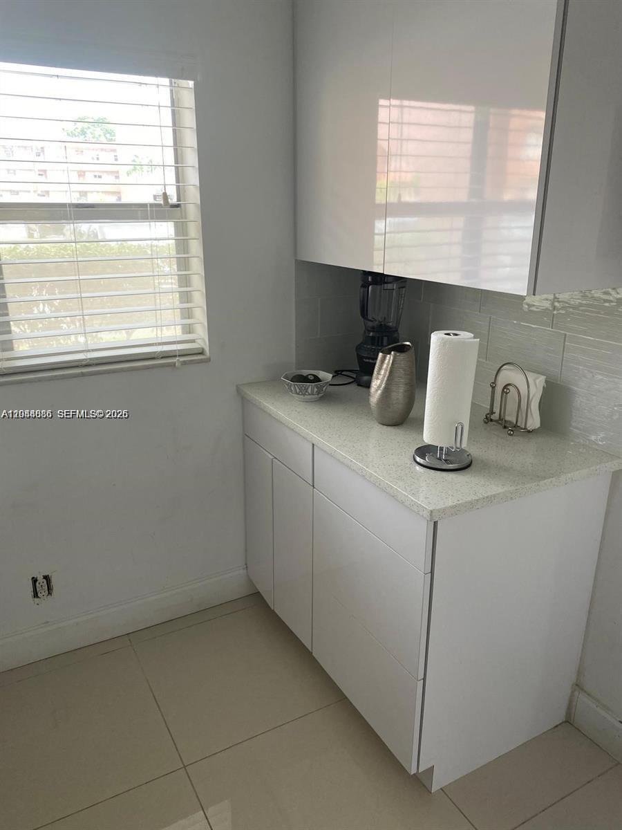 8838 West McNab Road, Unit 104 Tamarac, FL 33321 - Photo 6 of 23 a room with storage and utility