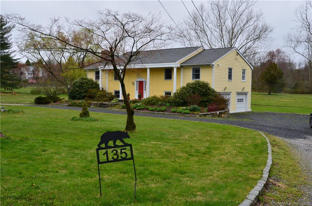 a house view with a garden space