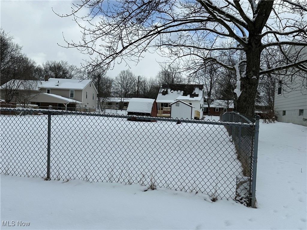4058 Pardee Road Stow, OH 44224 - Photo 6 of 24 Yard covered in snow featuring fence