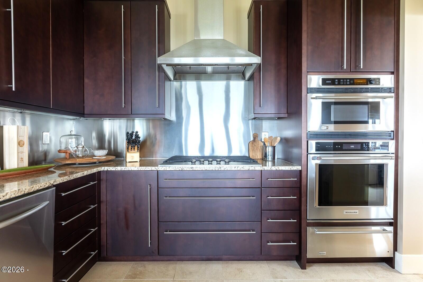 142 East Bay Point Road Gleneden Beach, OR 97388 - Photo 13 of 49 a kitchen with a stove and a microwave