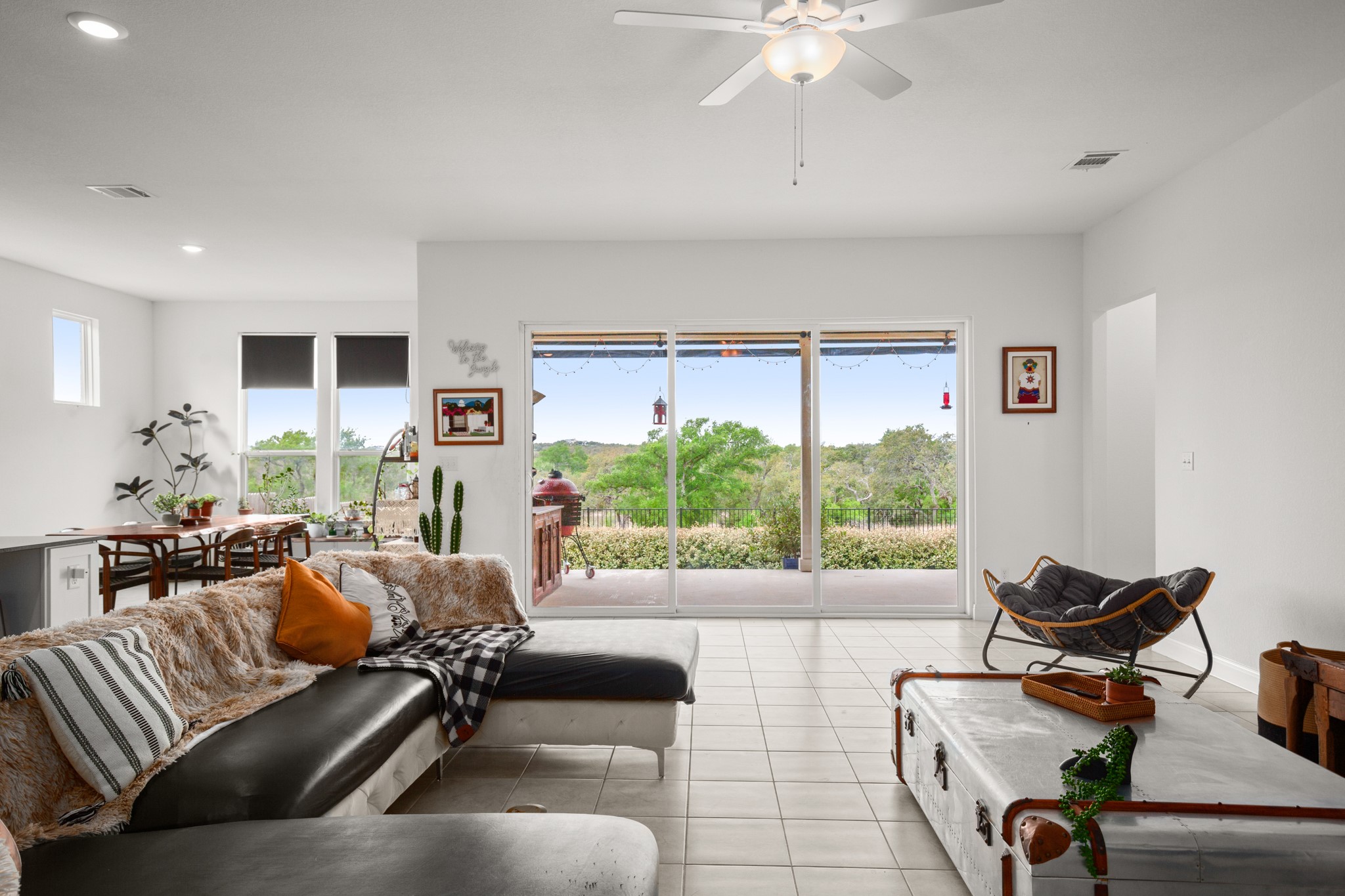385 Barn Hill Loop Dripping Springs, TX 78620 - Photo 1 of 1 a living room with furniture and a large window