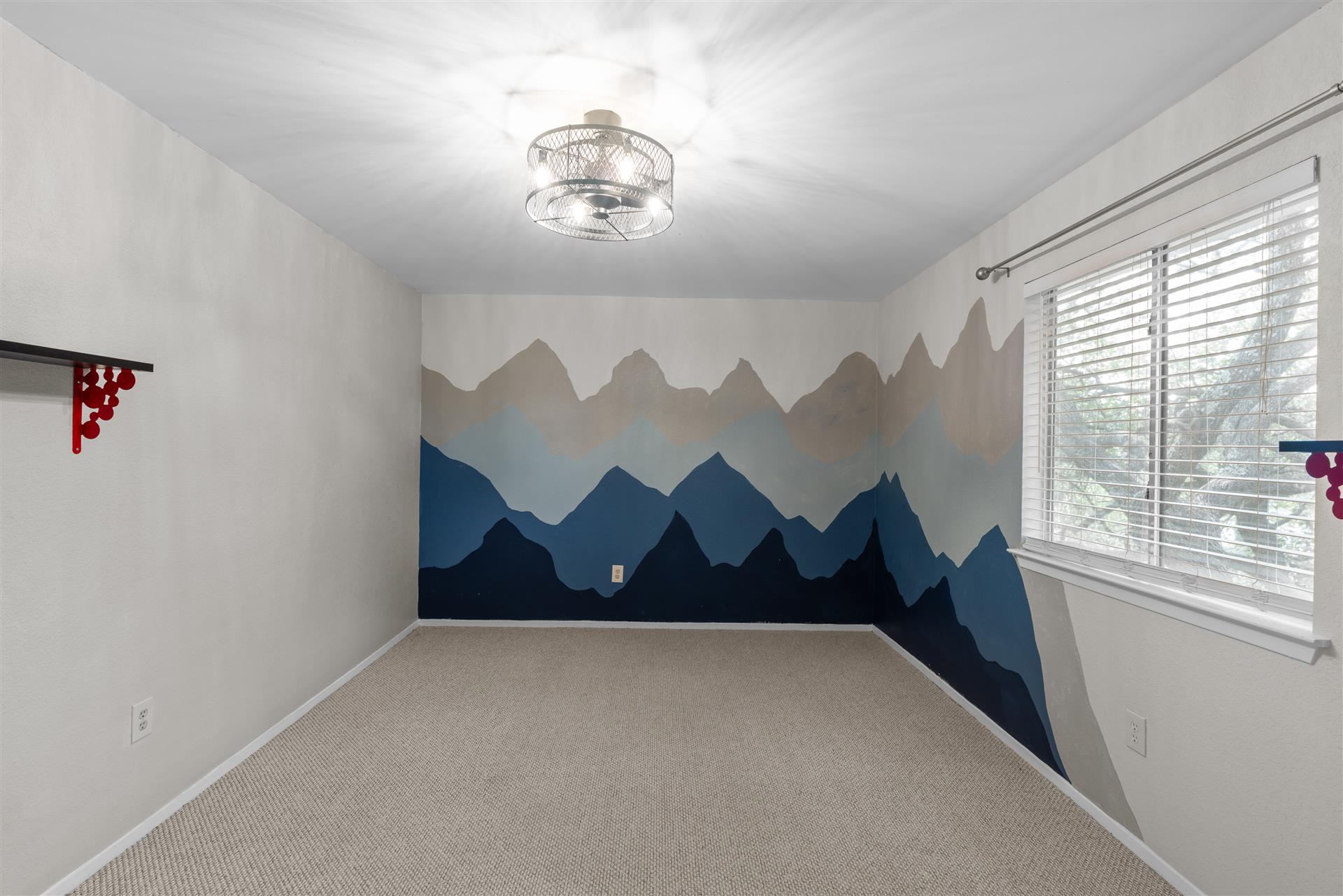 1710 Persimmon Road Cedar Park, TX 78613 - Photo 23 of 33 Secondary bedroom #1 with unique mountain-themed wall art, offering a personalized retreat.