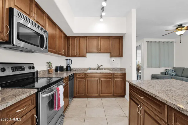 a kitchen with a sink stove and microwave