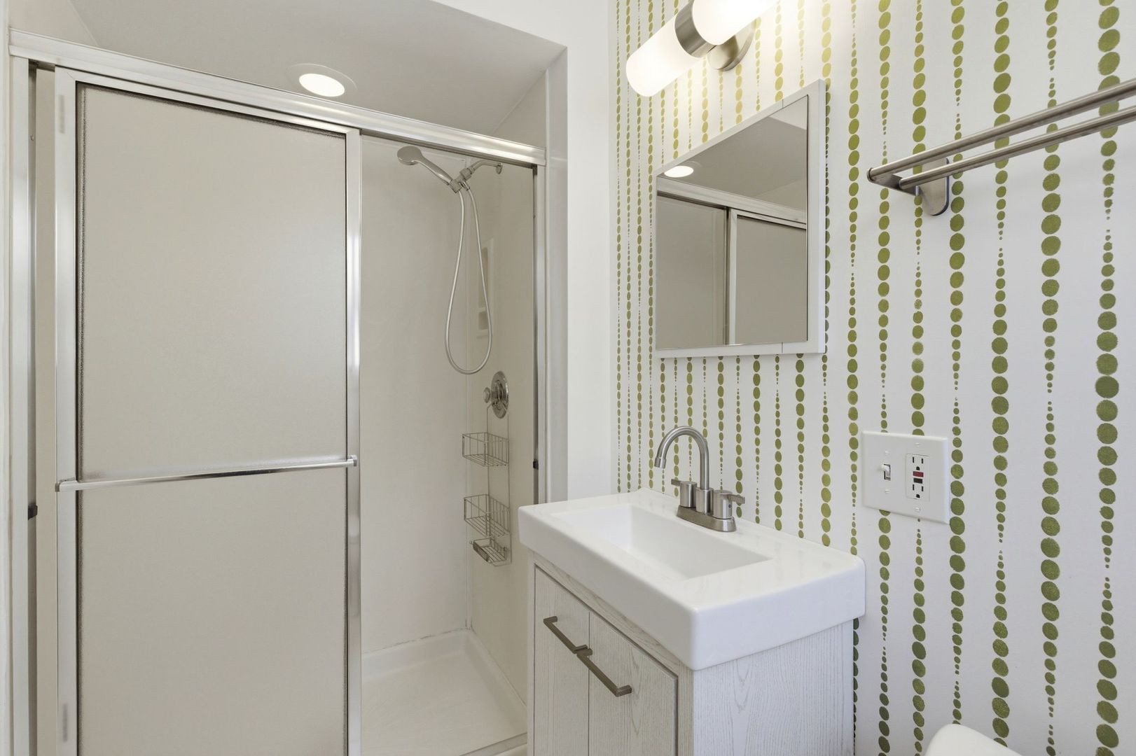 556 Barton Avenue, Unit 2 Evanston, IL 60202 - Photo 14 of 21 a bathroom with a sink mirror and shower