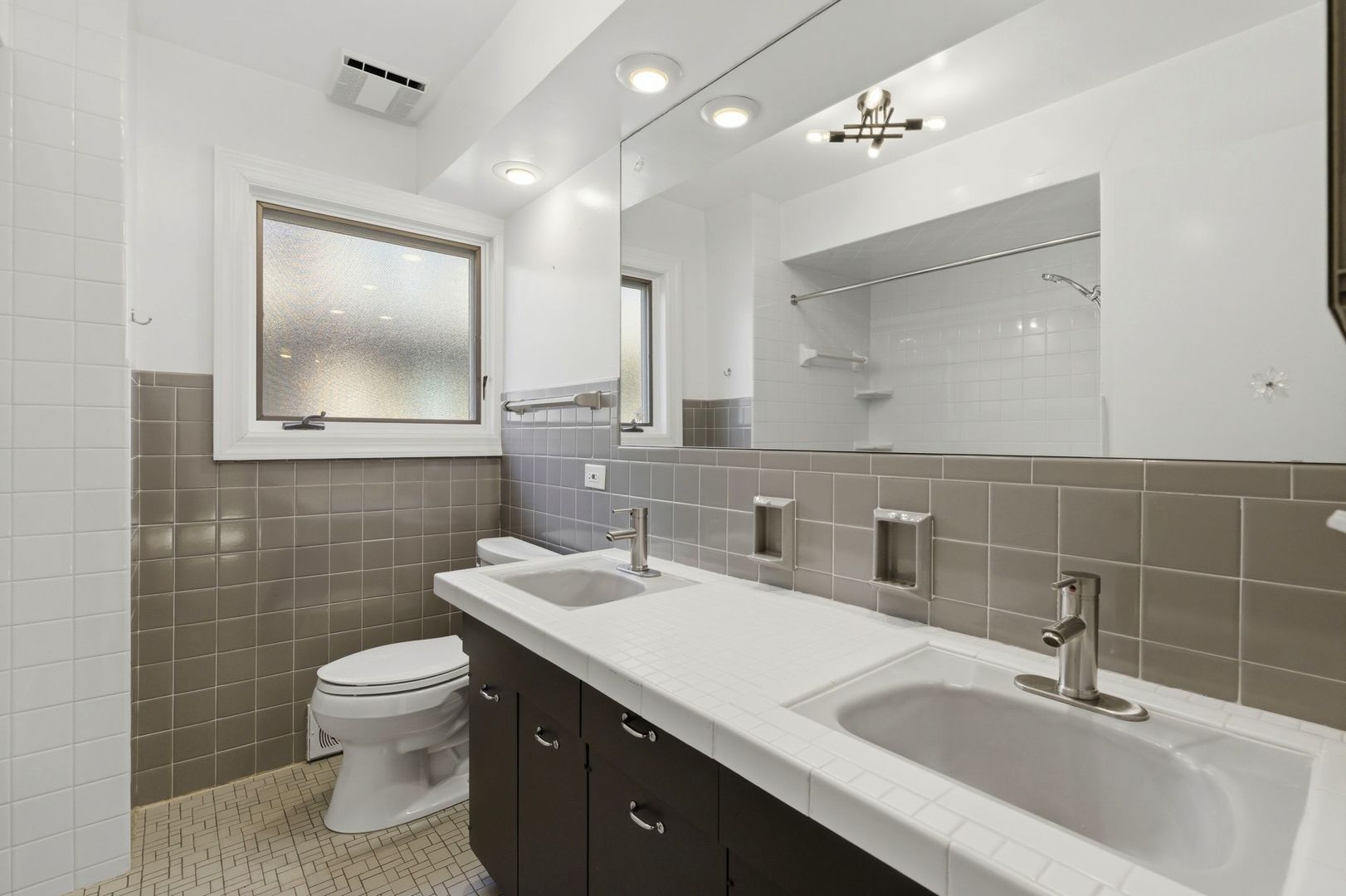 556 Barton Avenue, Unit 2 Evanston, IL 60202 - Photo 18 of 21 a bathroom with a toilet sink and mirror