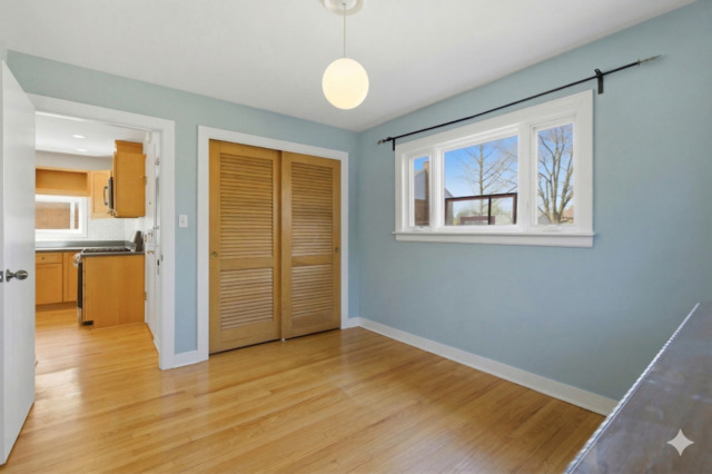 556 Barton Avenue, Unit 2 Evanston, IL 60202 - Photo 19 of 21 wooden floor in an empty room with a window