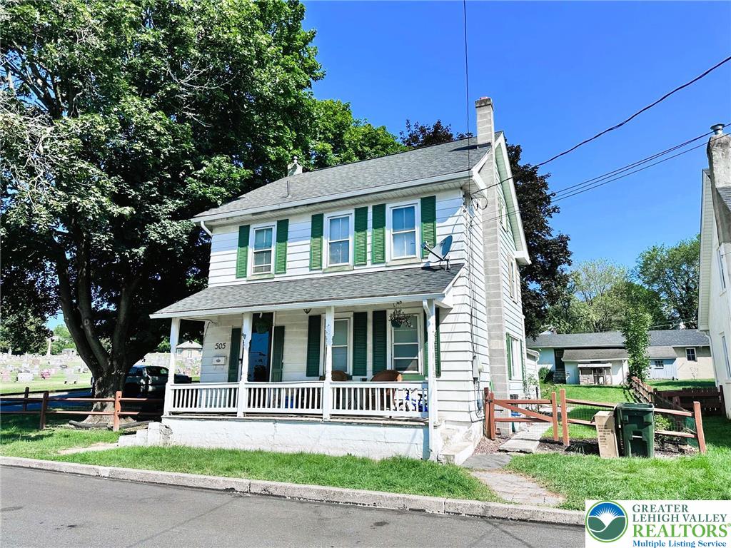 505 Penn Street Bath, PA 18014 - Photo 1 of 23 a front view of a house with a garden