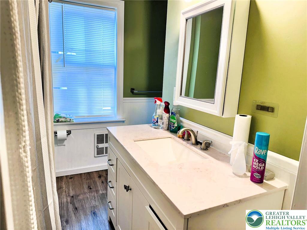 505 Penn Street Bath, PA 18014 - Photo 13 of 23 a bathroom with a sink and a mirror