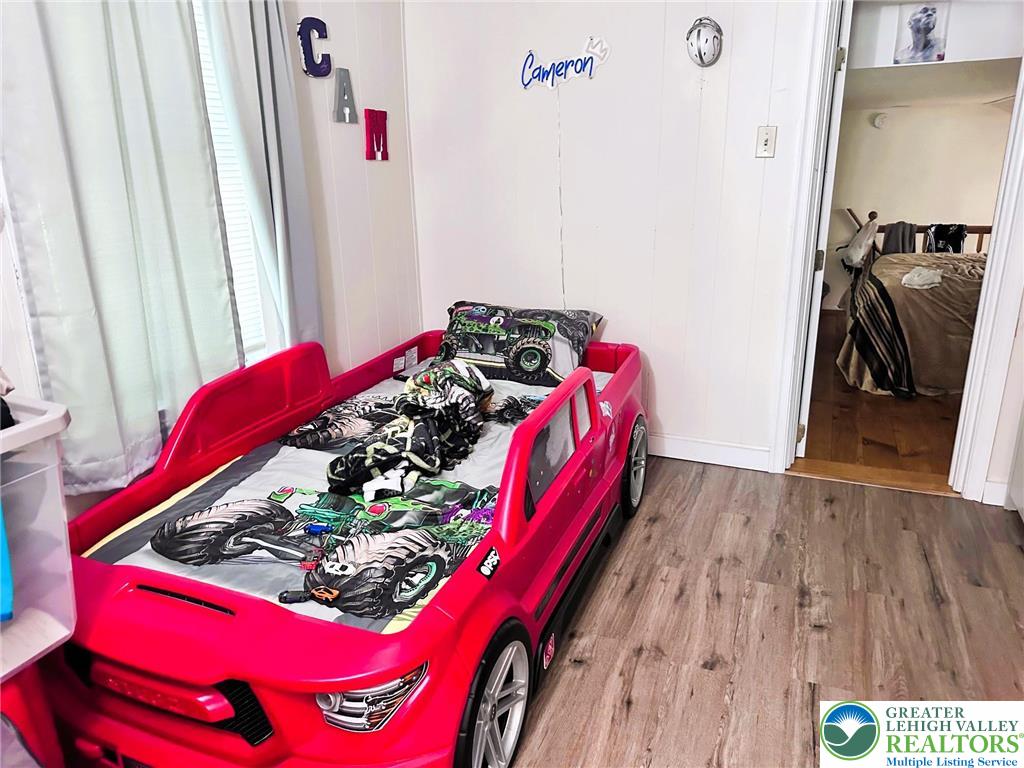 505 Penn Street Bath, PA 18014 - Photo 14 of 23 a bed room with a bed and a window