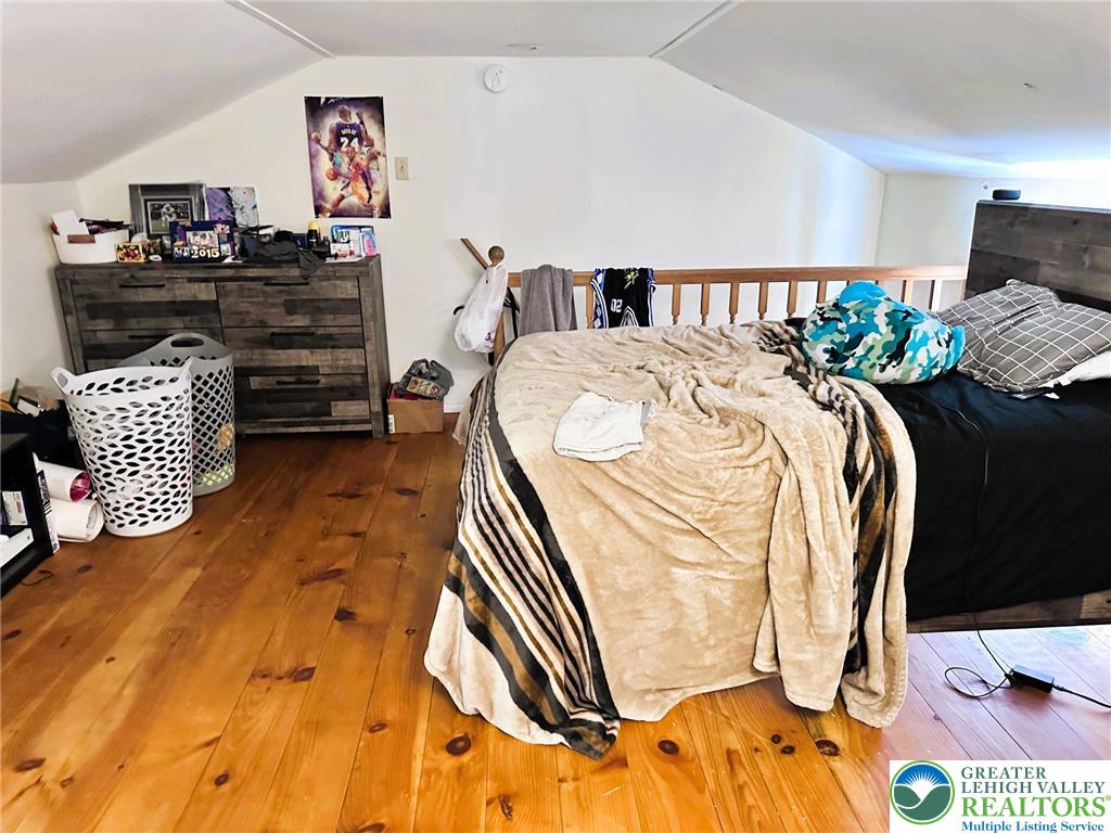 505 Penn Street Bath, PA 18014 - Photo 15 of 23 a bedroom with a bed and a painting on the wall