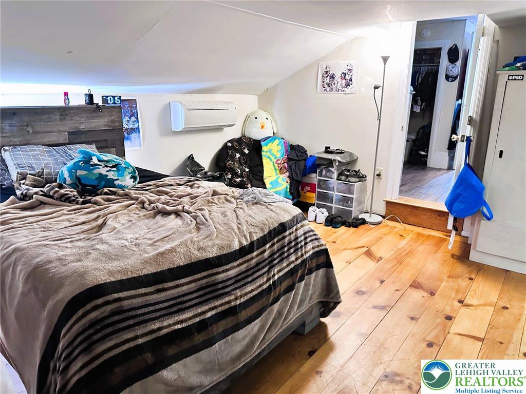 505 Penn Street Bath, PA 18014 - Photo 16 of 23 a bed sitting in a bedroom next to a window