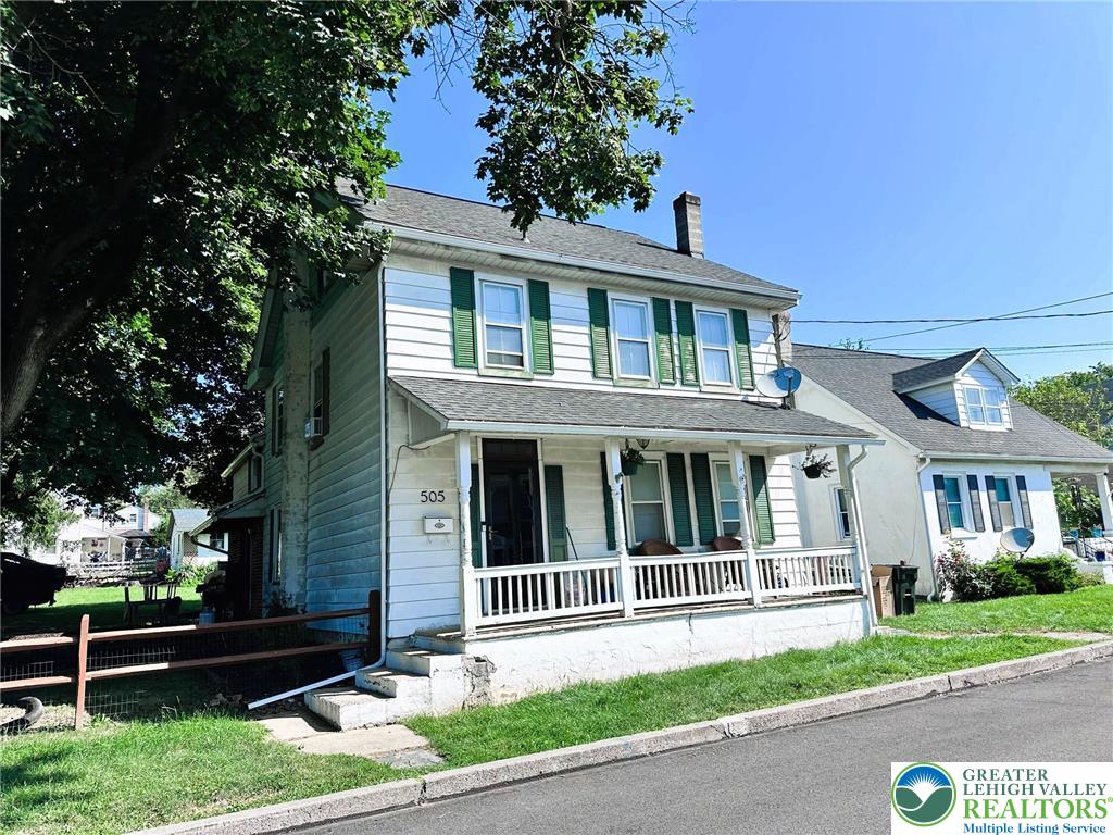 505 Penn Street Bath, PA 18014 - Photo 3 of 23 a front view of a house with a yard
