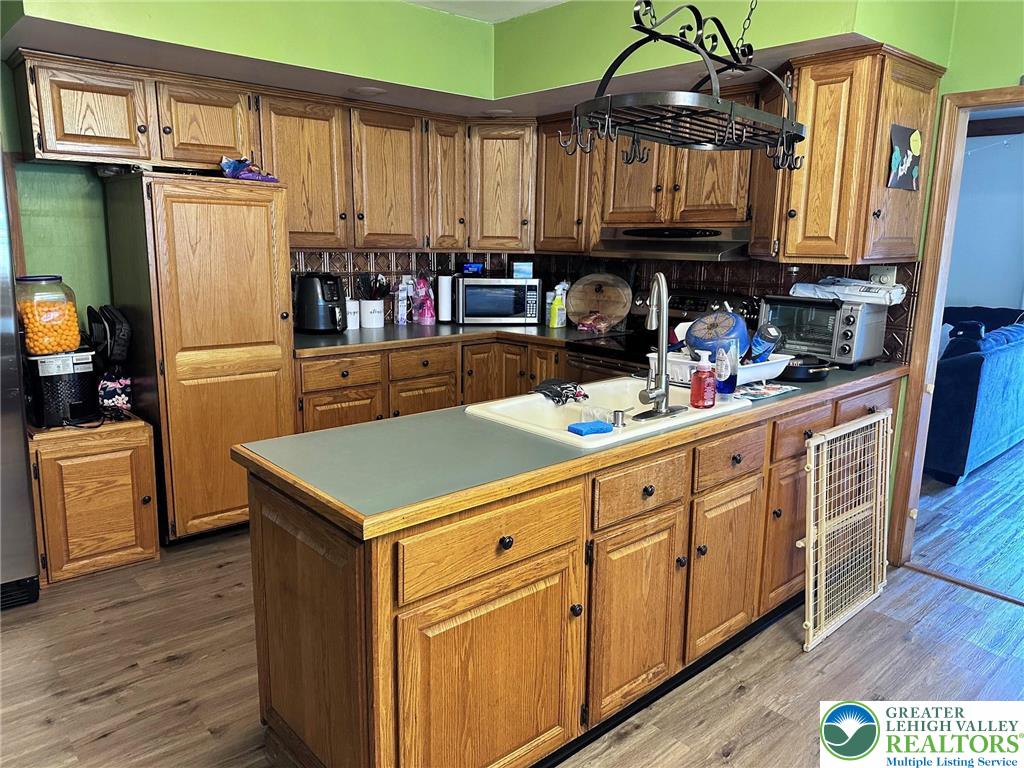 505 Penn Street Bath, PA 18014 - Photo 4 of 23 a kitchen with stainless steel appliances granite countertop a refrigerator sink and cabinets