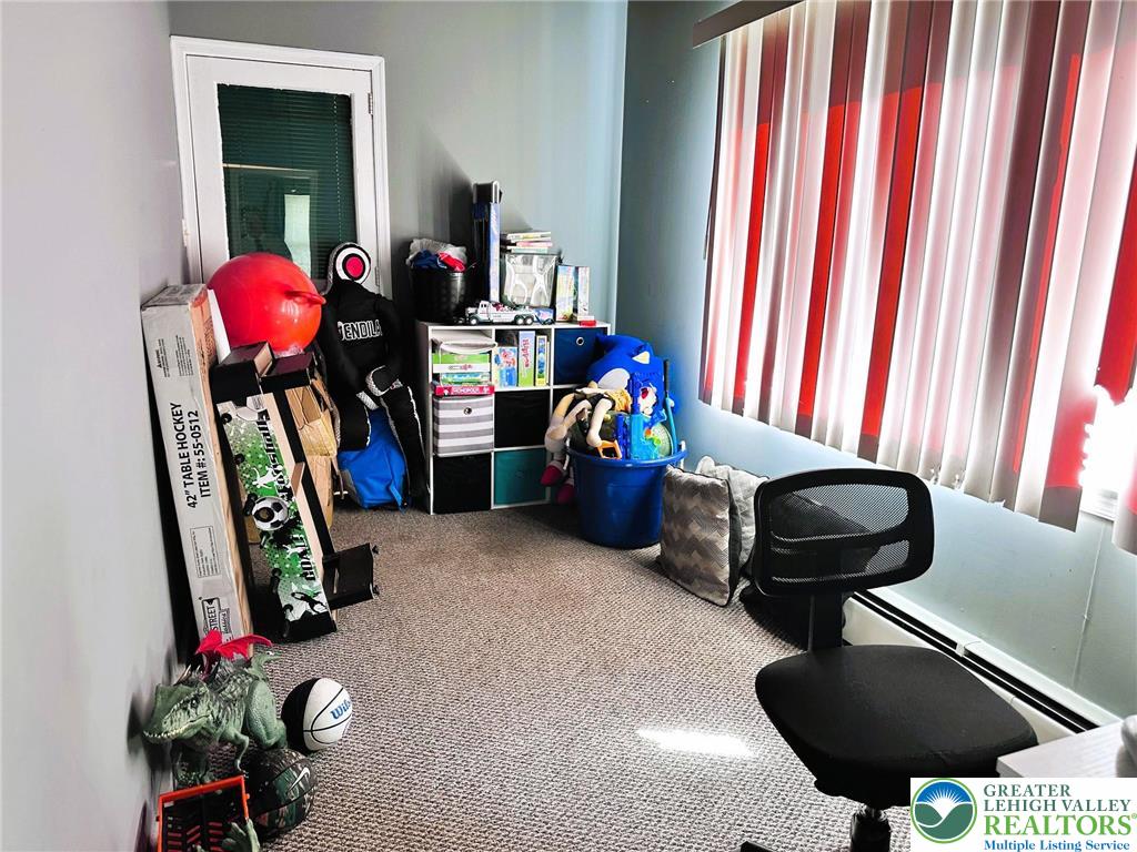 505 Penn Street Bath, PA 18014 - Photo 9 of 23 a room with furniture and a potted plant