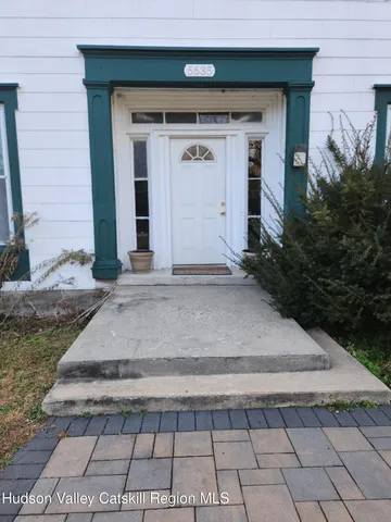 a front view of a house with shower