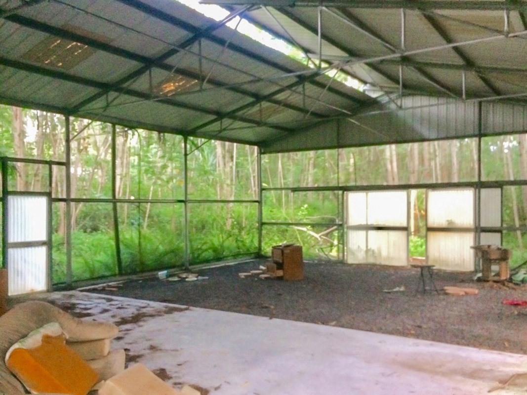 6 Pakaka Road Pahoa, HI 96778 - Photo 1 of 7 a view of garage with a table and chairs
