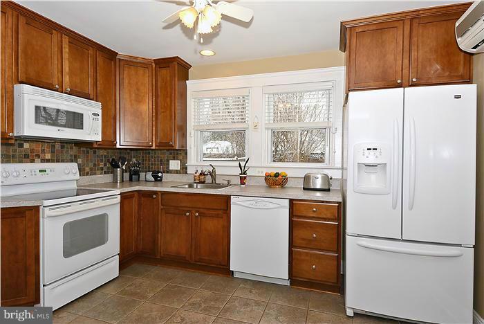 2 Cedarwood Road Baltimore, MD 21228 - Photo 12 of 30 Newer Kitchen with Tile Floor and Warm Cabinetry.