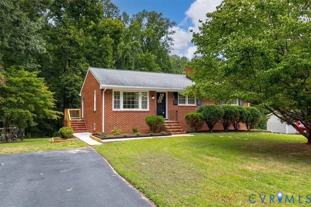 3308 Sylvania Road Chester, VA 23831 - Photo 2 of 55 Brick exterior with white window trim and black sh