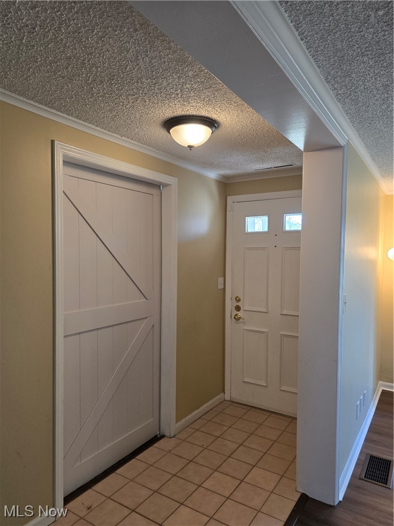 994 Som Center Road, Unit D2 Cleveland, OH 44143 - Photo 2 of 20 Entrance foyer featuring ceramic tile and door to office/extra room