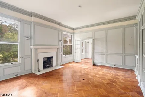 a view of empty room with a fireplace