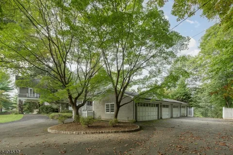 front view of a house with a trees