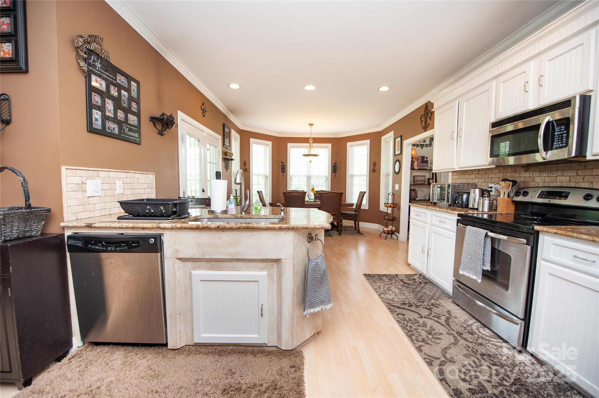 2650 Rainbow Lake Road Inman, SC 29349 - Photo 21 of 48 a kitchen with stainless steel appliances granite countertop a stove a sink and a microwave