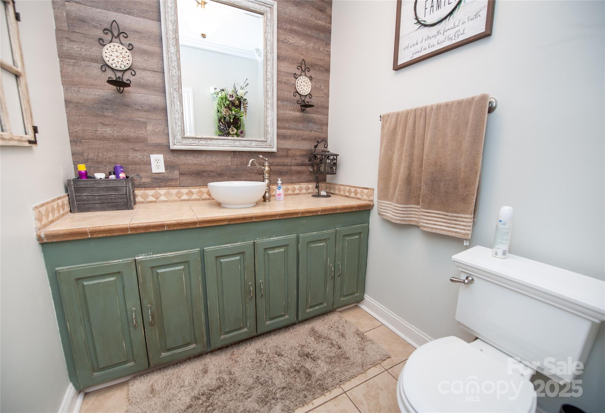 2650 Rainbow Lake Road Inman, SC 29349 - Photo 32 of 48 a bathroom with a sink a toilet and mirror