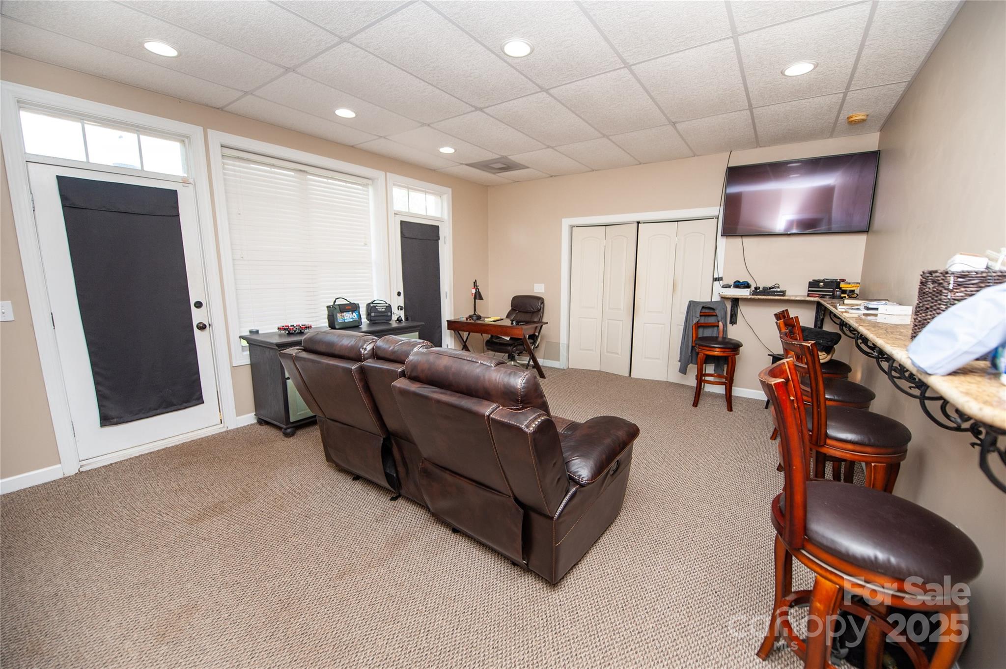2650 Rainbow Lake Road Inman, SC 29349 - Photo 35 of 48 a living room with furniture a flat screen tv and kitchen view