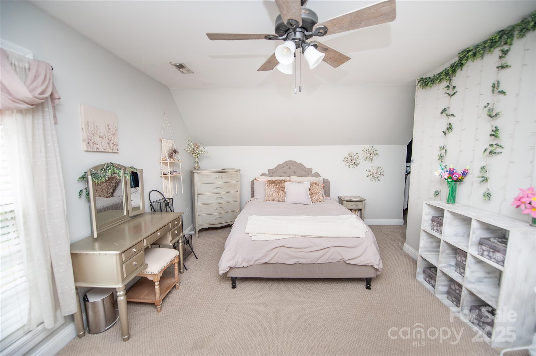 2650 Rainbow Lake Road Inman, SC 29349 - Photo 45 of 48 a bedroom with a bed and a chandelier