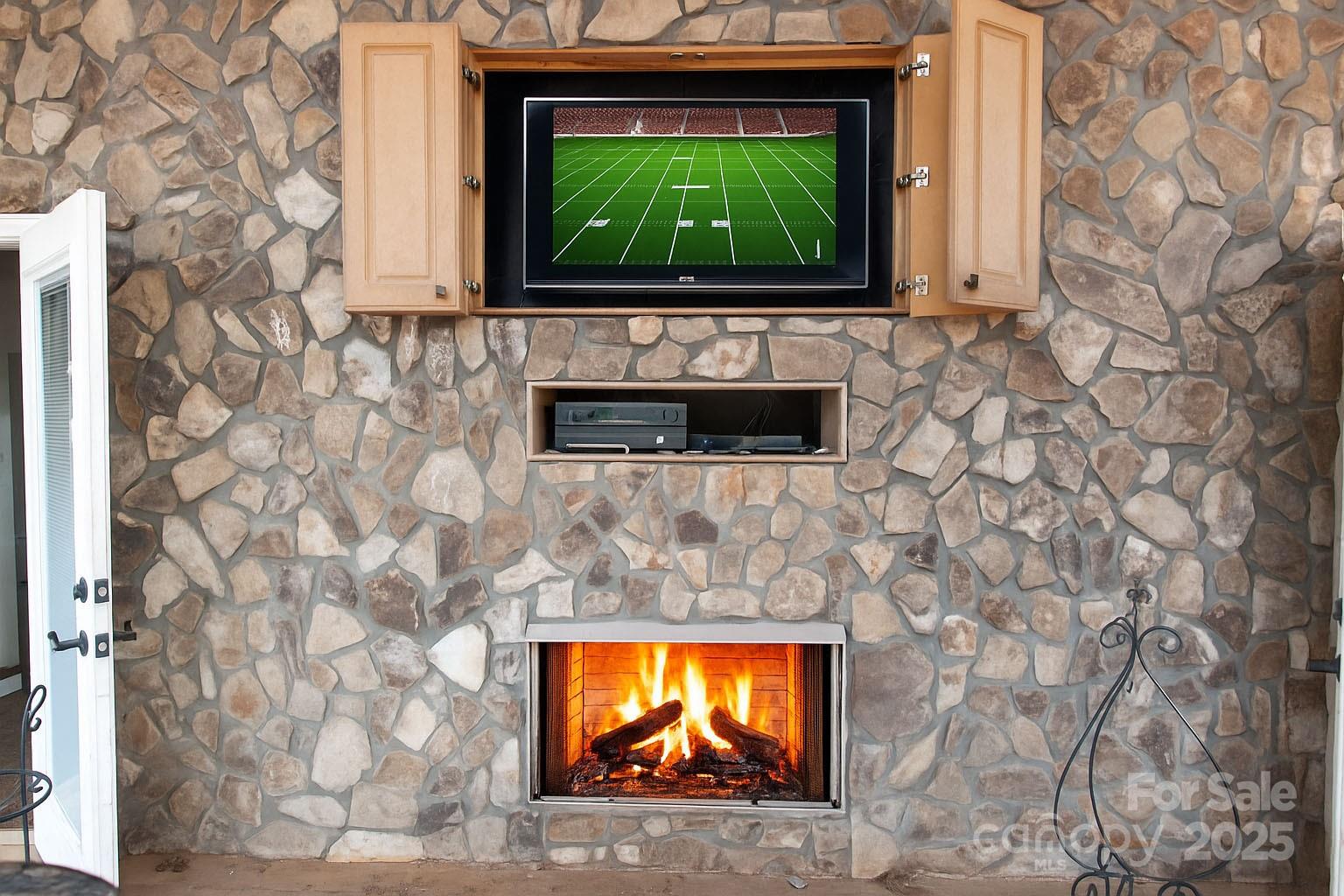 2650 Rainbow Lake Road Inman, SC 29349 - Photo 47 of 48 a living room with a fireplace and a flat screen tv