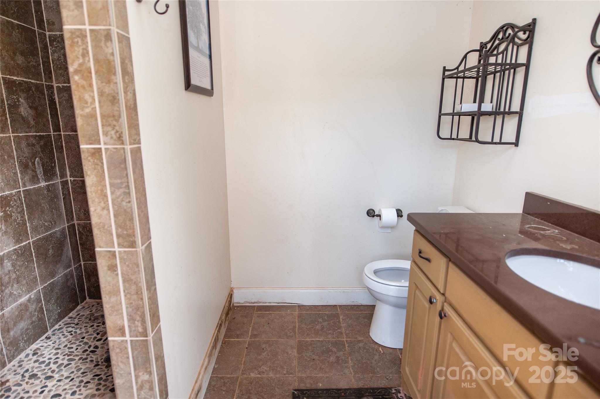 2650 Rainbow Lake Road Inman, SC 29349 - Photo 48 of 48 a bathroom with a granite countertop sink toilet and shower