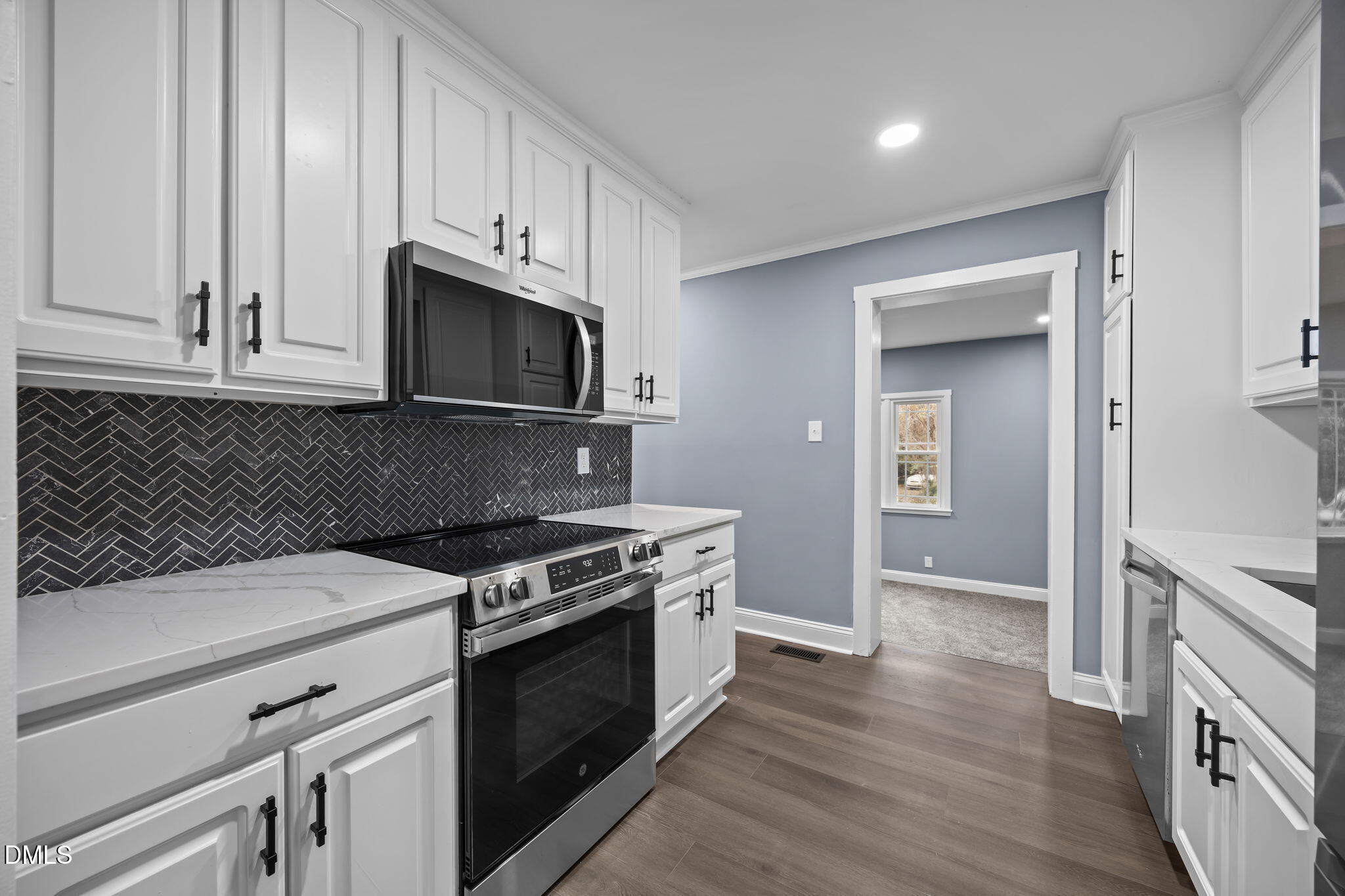 3000 Brentwood Road Raleigh, NC 27604 - Photo 15 of 41 a kitchen with granite countertop wooden cabinets and stainless steel appliances